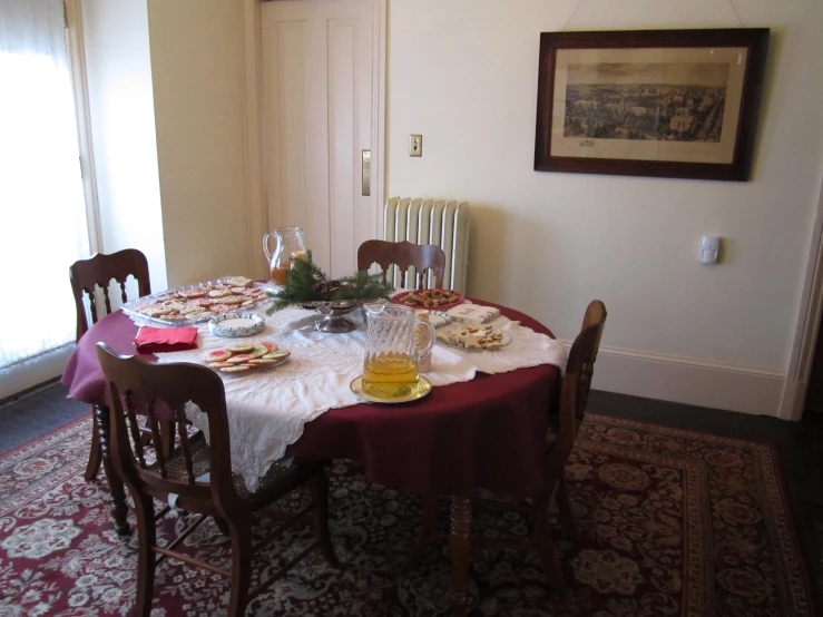 a dining room table covered with plates of food