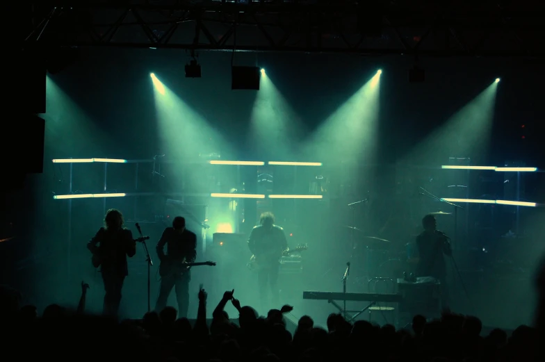 a band on stage playing and singing