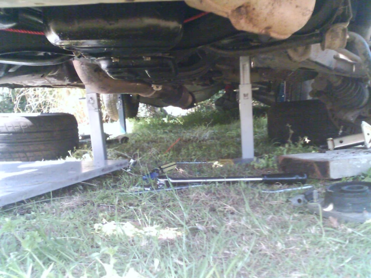 a truck with several rusted and old tires on it