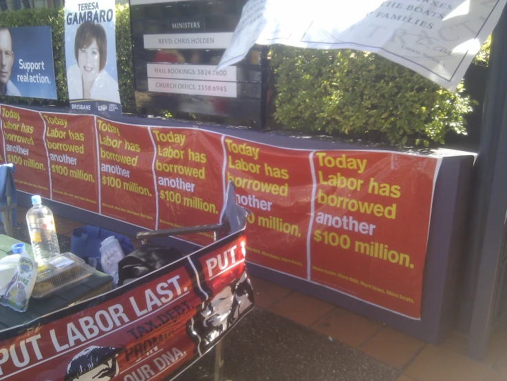 a display of the election signs behind a voting machine