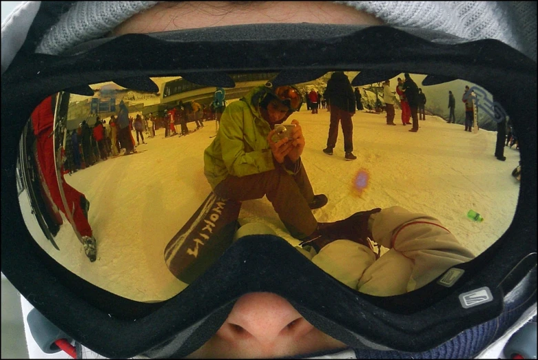 a man taking a picture of himself in ski goggles