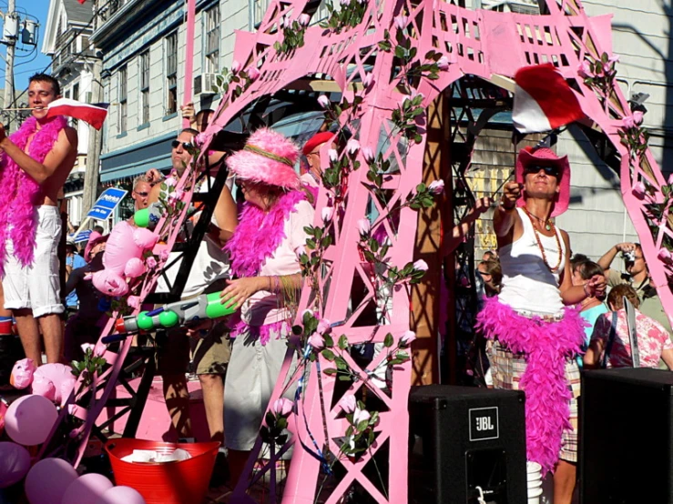 pink and white street performers in elaborate costumes