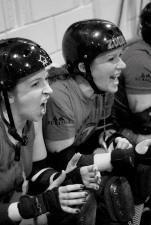 a girl roller blades wearing black helmet's, eating snacks