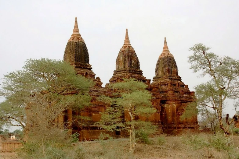 an ancient building with many spires on top of it