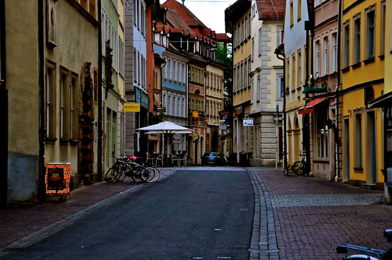 the street next to a row of buildings