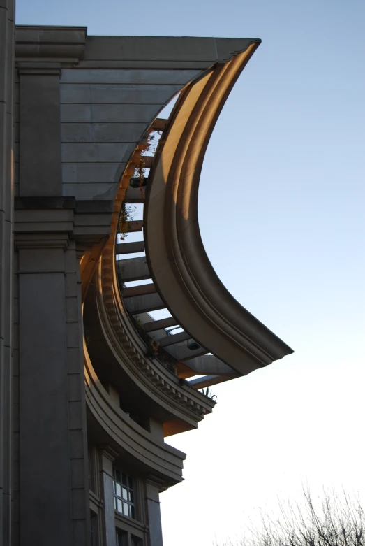 spirally curved staircase on the side of a building