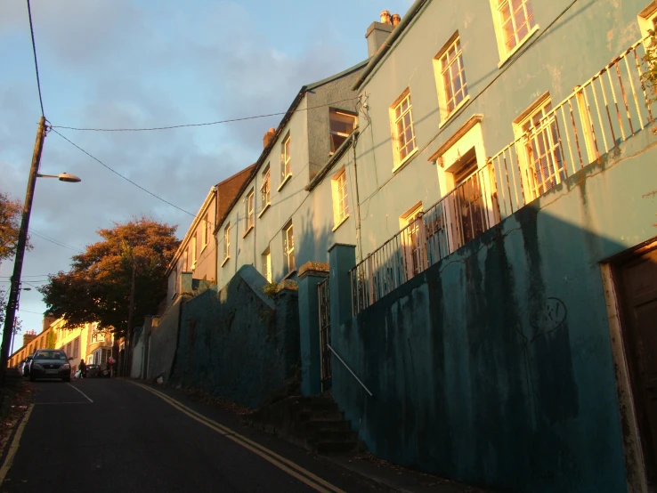 a street with tall buildings and windows on both sides of the street