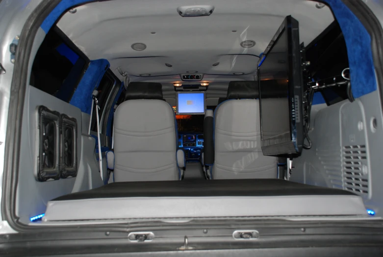 the back seats and rear door of a vehicle