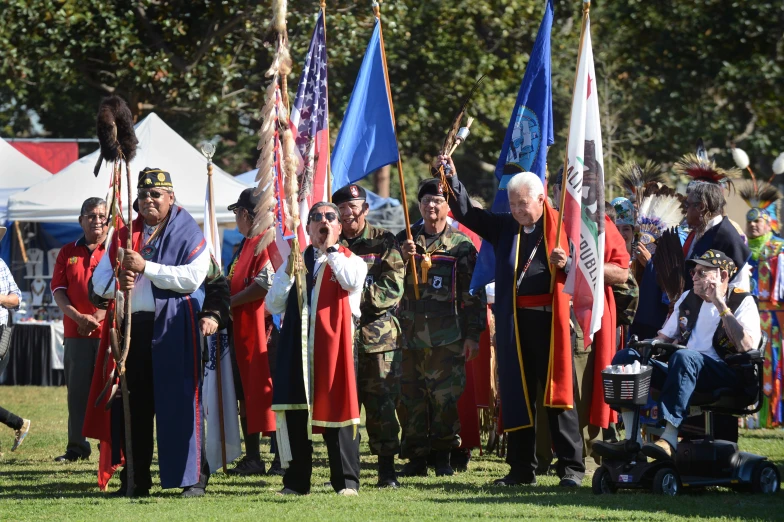 a group of men dressed in medieval costumes with flags