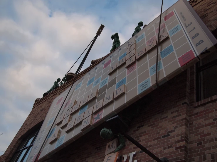 workers are putting up the second story of a building