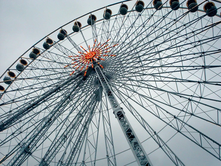 the large ferris wheel is facing upward towards the sky