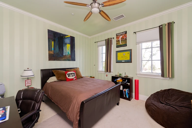 a bedroom that has been decorated with green stripes