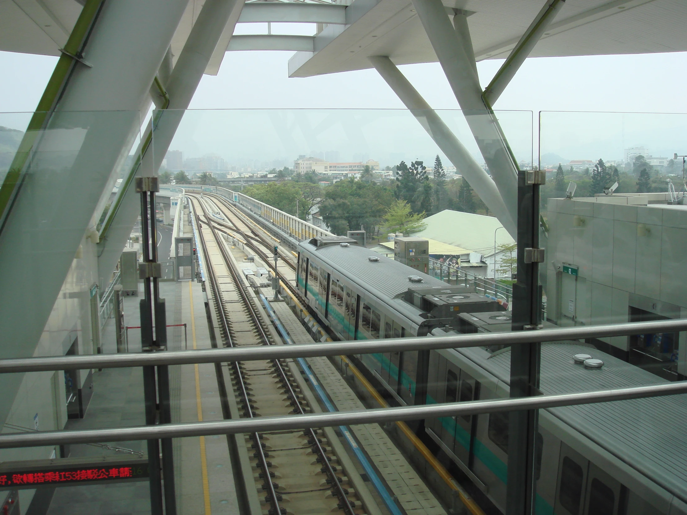 a view looking down at a train on the track