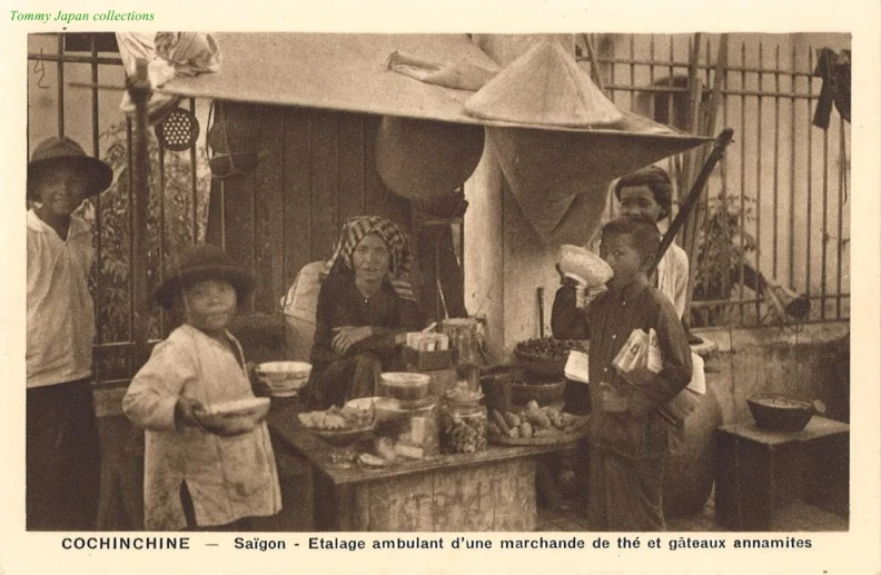 old pograph of people at a food stall