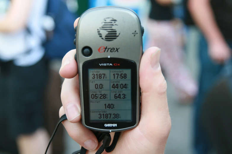 a close up of a person holding a cell phone in their hands