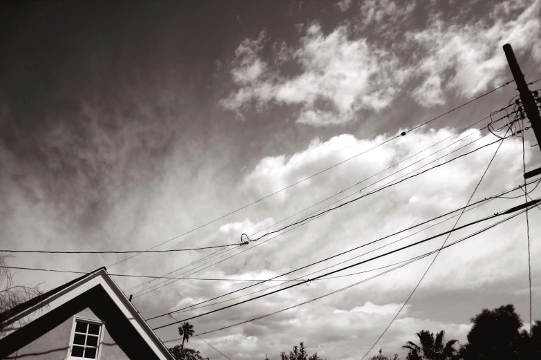 some power lines on the ground and a cloudy sky