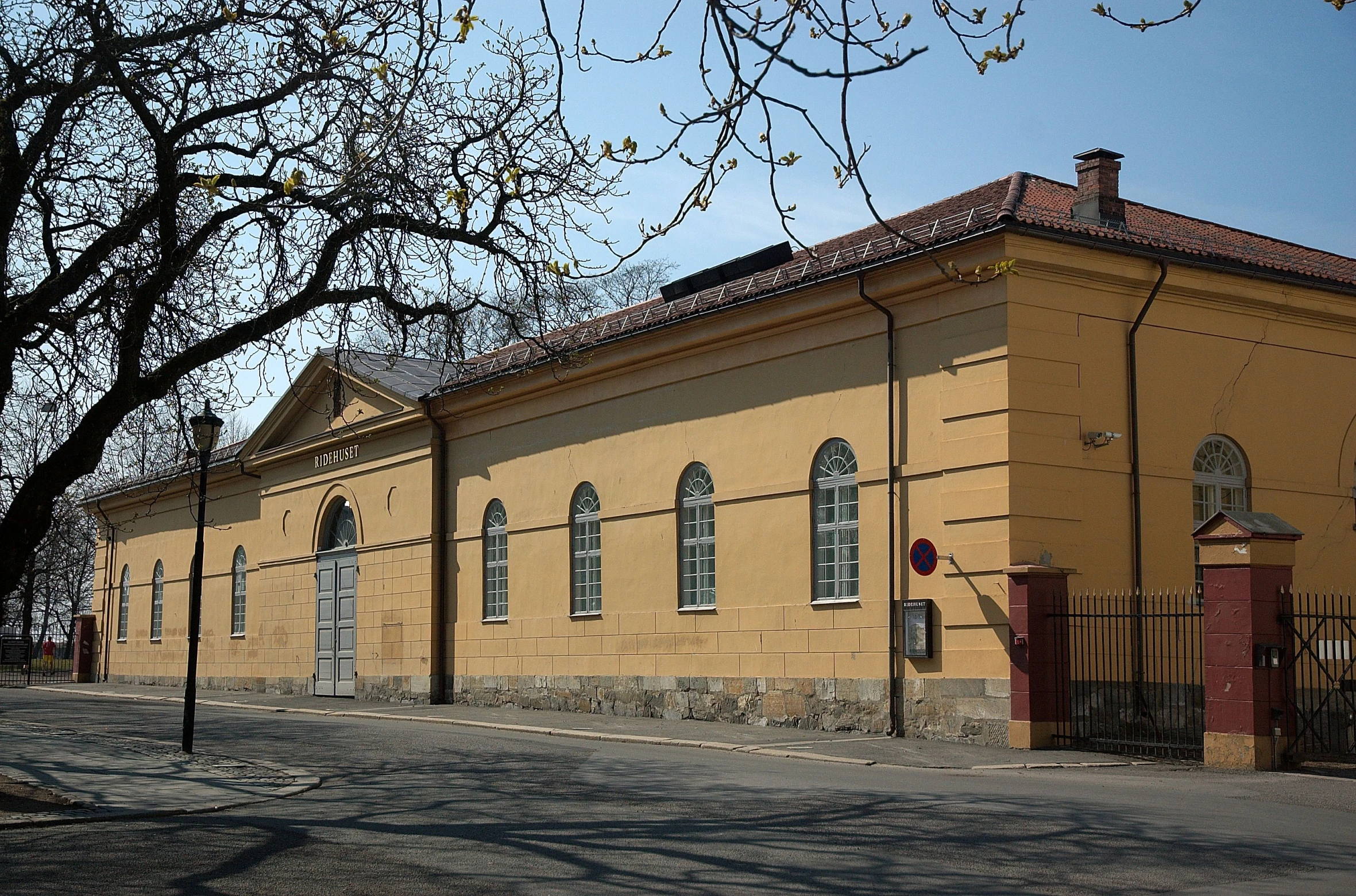 the building is made of stone and has tall windows