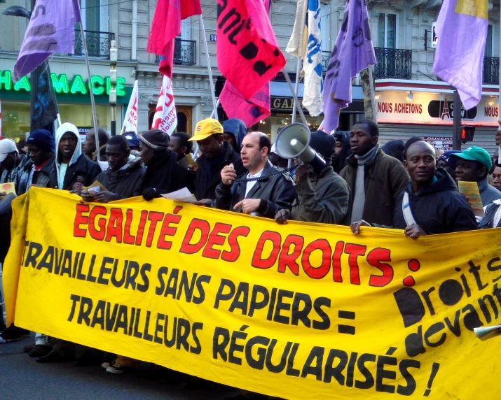 several people hold a sign for the rights of the rights march