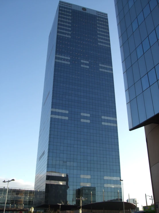 an office building with the sky in the background