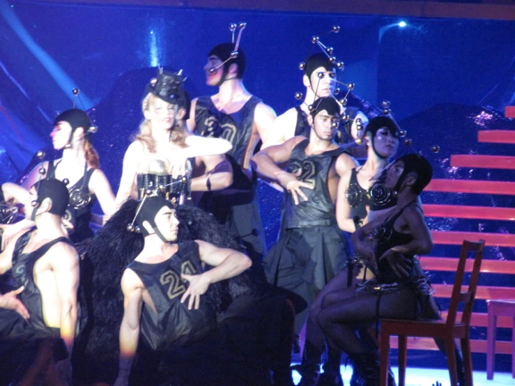 a group of people that are on stage in costumes