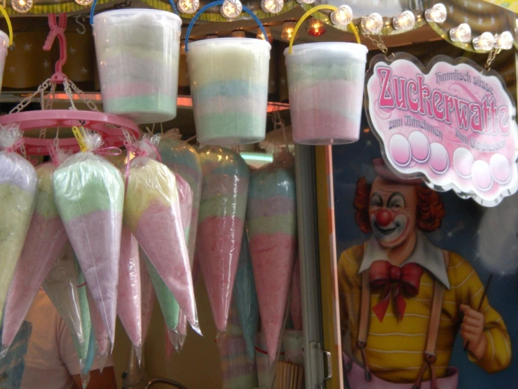 various colorful lollipops are displayed in a store