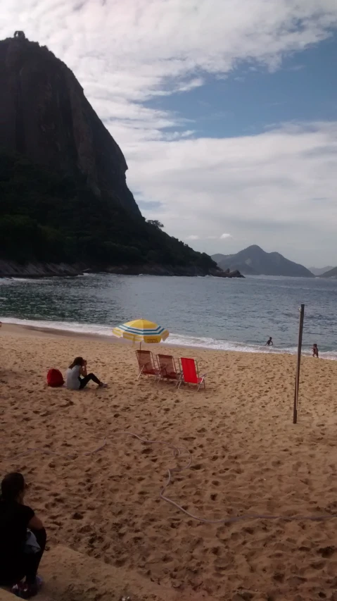 a beach with umbrellas and chairs on it