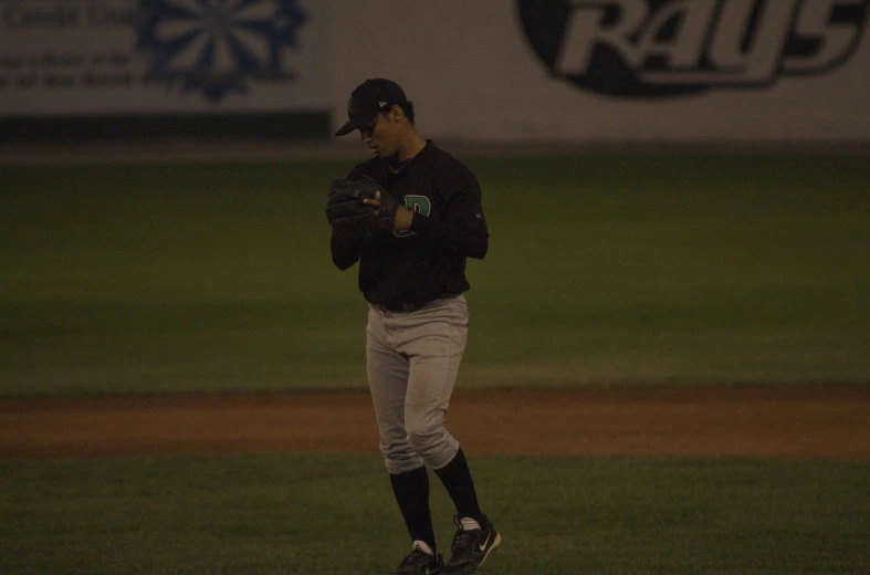 a baseball player walks on the field