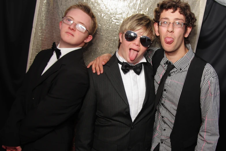 three guys in suit and tie posing for the camera