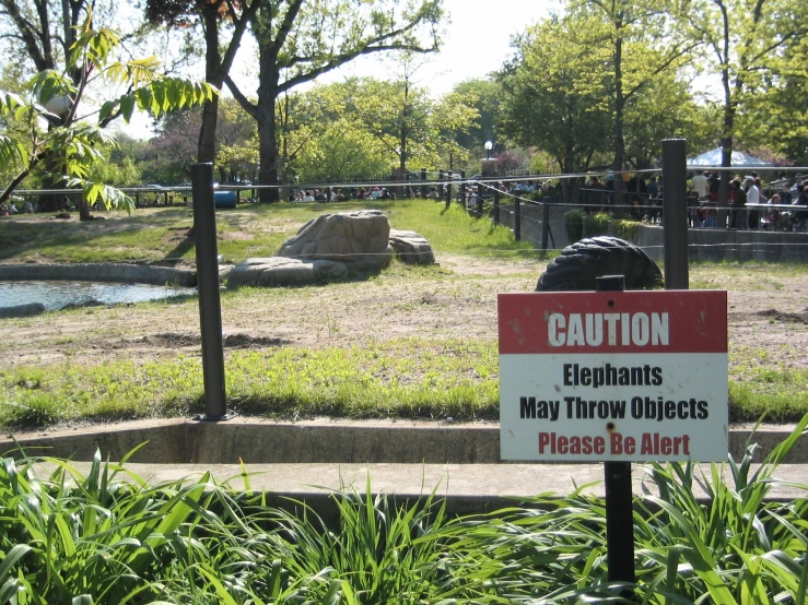 a sign warning people to beware of elephants