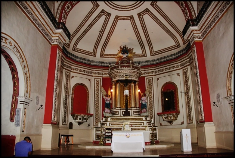 a church with many windows and benches with people