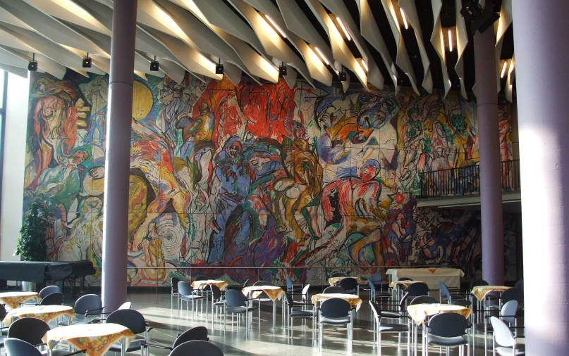 a very large art work on the wall of a restaurant