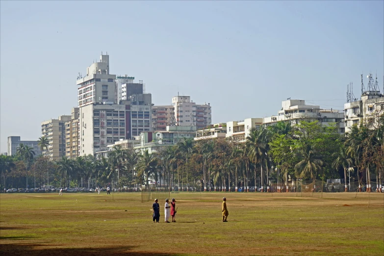 a group of people that are in the grass