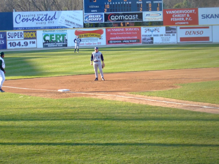 a number of baseball players on a field playing ball