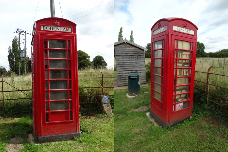 a couple of red telephone booth sitting in a field