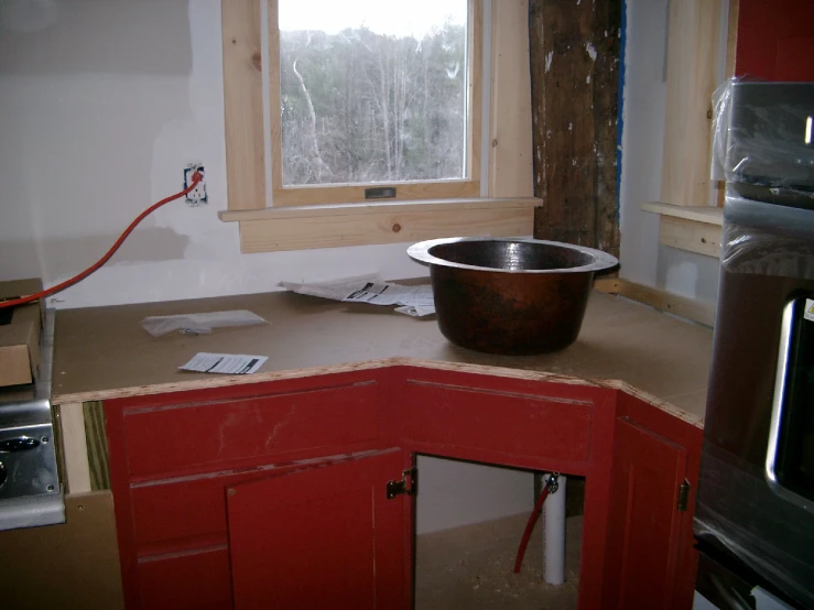 a stainless steel bowl sits on a counter top