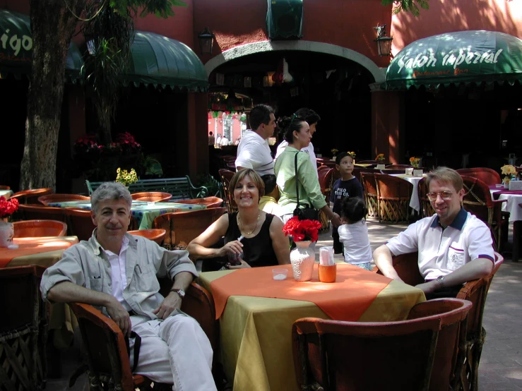 the people are enjoying each other's company in the restaurant