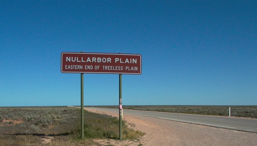 a highway sign that is by the side of the road