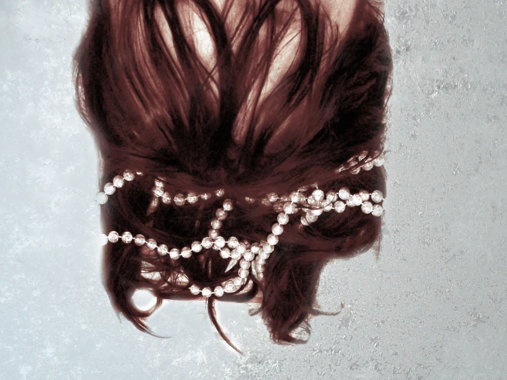 this is a close up image of someones hair with beads