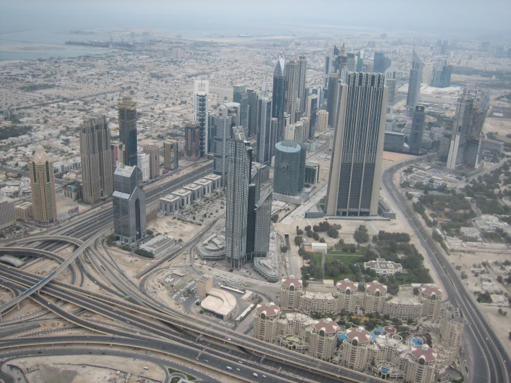 a group of buildings stand in the middle of a city