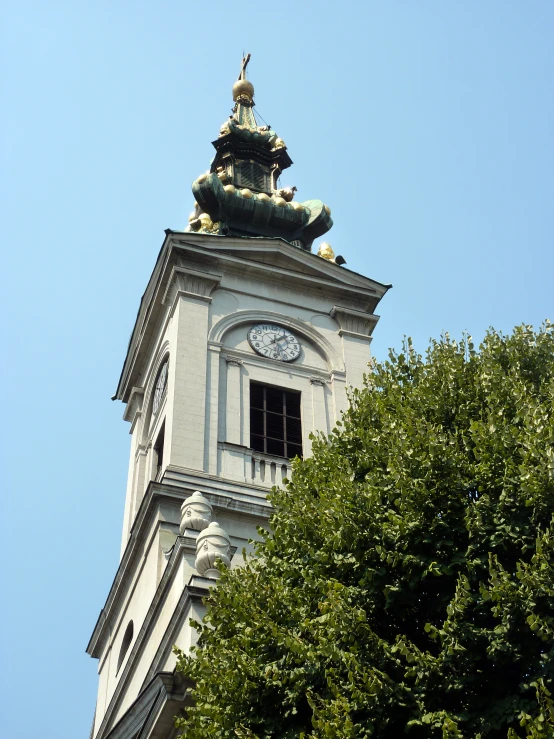 the top of a tall building with a clock