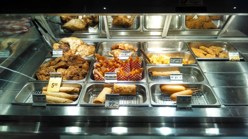 a display case filled with lots of different kinds of food