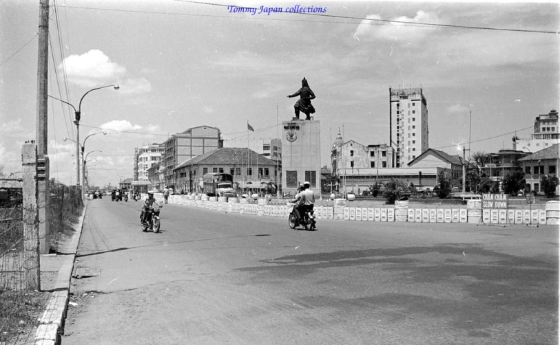 there are many people on motorcycles going down the street