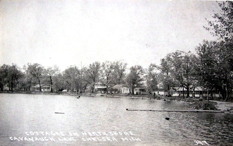 a lake and a row of houses, in the late 19th century