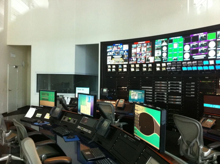 a control room filled with lots of monitors