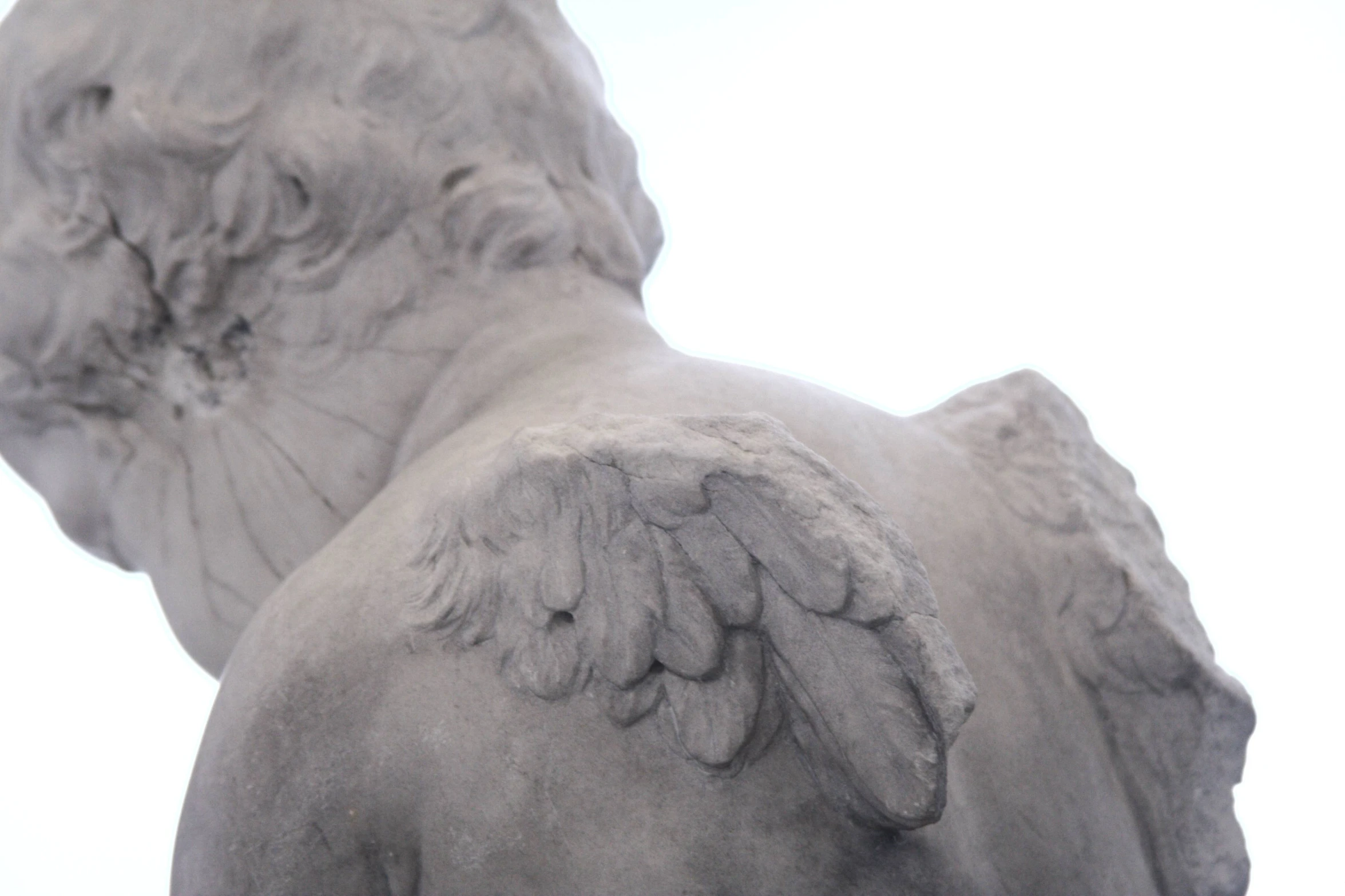 an angel statue with its wings outstretched