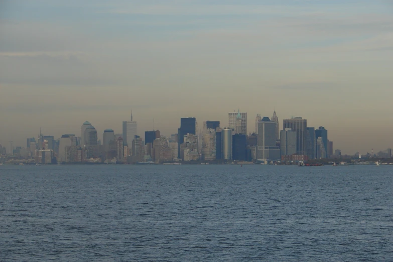 large body of water with a city skyline in the background