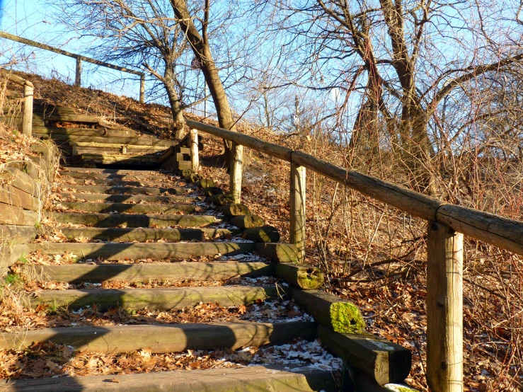 some stairs in the middle of a stone wall