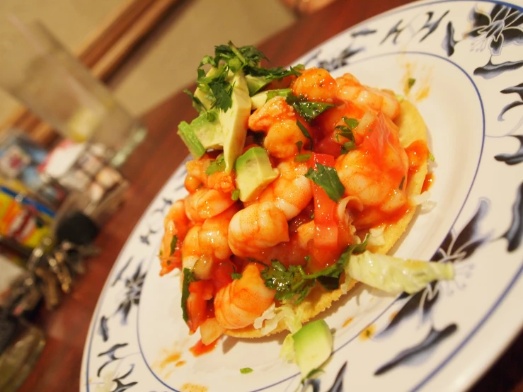 a plate of shrimp, celery and garnish on toasted bread