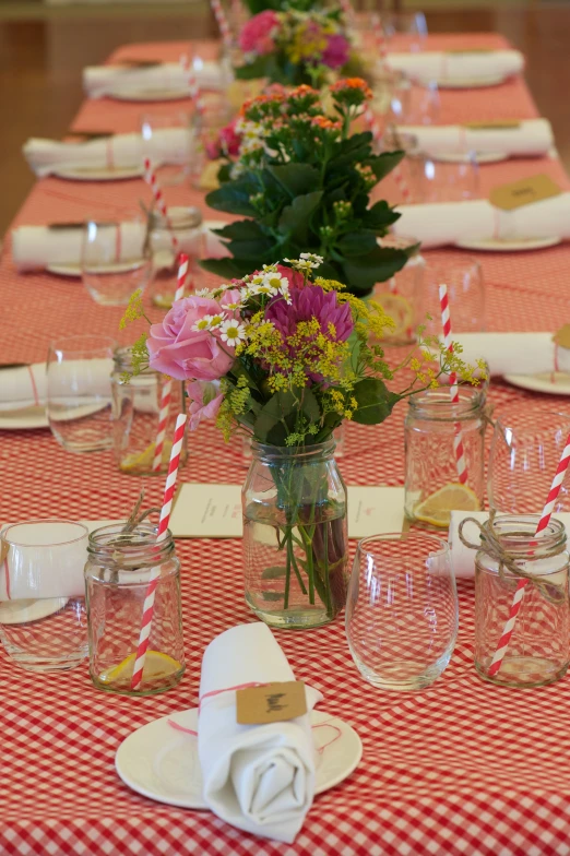 the table is set with place settings and dishes for a wedding