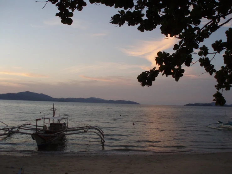 a ship on the water with land in the distance